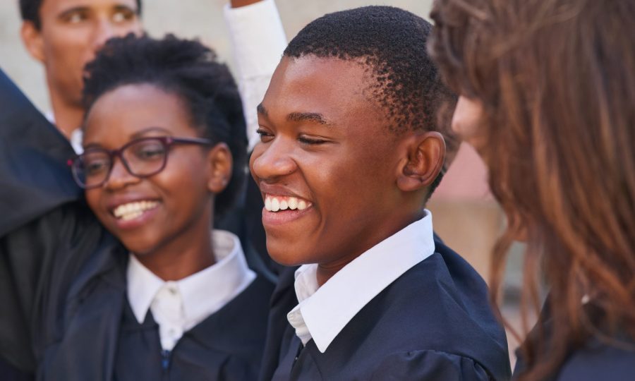 Friends, graduation and celebration at campus, outdoor and happy for success, goals and education at college. People, group and students with achievement, excited or smile for milestone at university